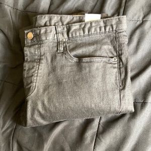 Waxed denim skinny jeans frm Mnml. Button up crotch w/ zipper seams at ankles.